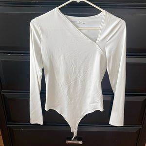Asymmetrical neckline - white bodysuit
